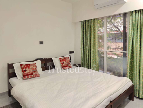 Bedroom one of TrustedStay Sanghvi Infenia Service Apartment in Santacruz East, Mumbai